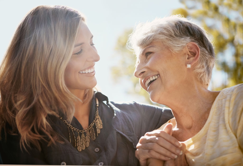 Shot of a happy senior woman spending quality time with her daughter outdoors