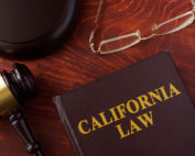 Book with title California law and a gavel.